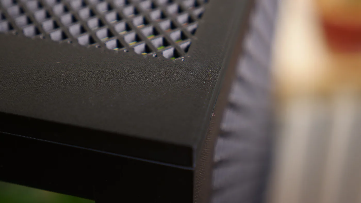 Macro detail of the Tank Top 1.0 durable 3D-printed frame and perforated top